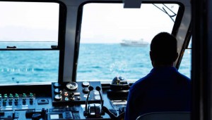 Man steering boat