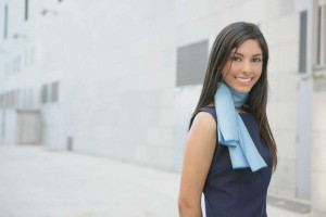 Beautiful blue dress stewardess walking to convention center