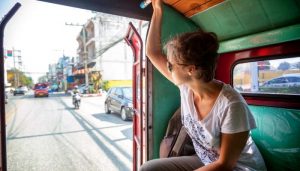 woman tourist traveling to the Thai public transport, Songteo